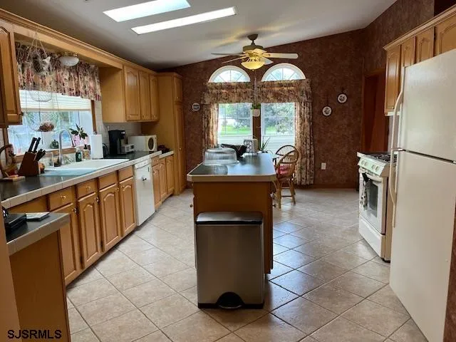 a kitchen with counter top space and appliances