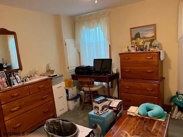 a bedroom with a bed and furniture