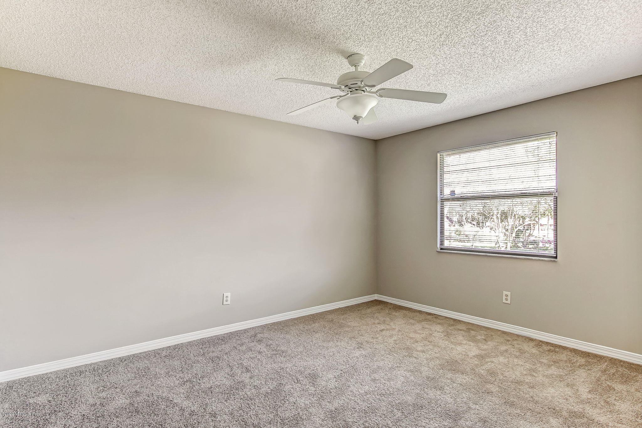 350 Foxridge Road Orange Park, FL 32065 - Photo 15 of 54 an empty room with a window and a fan