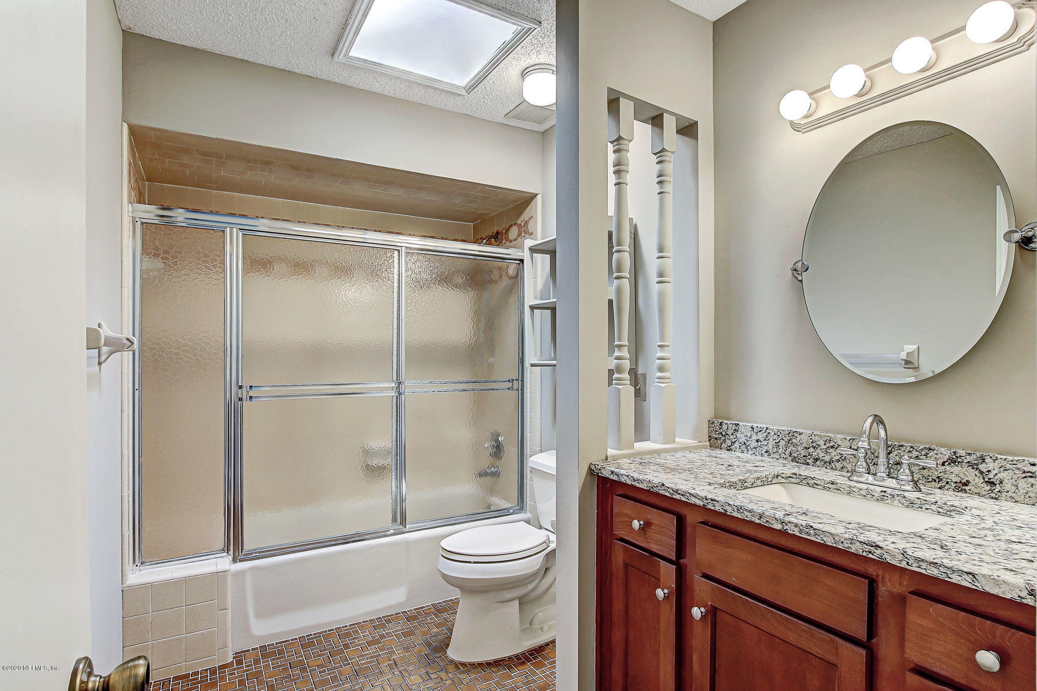 350 Foxridge Road Orange Park, FL 32065 - Photo 16 of 54 a bathroom with a granite countertop sink toilet mirror and shower