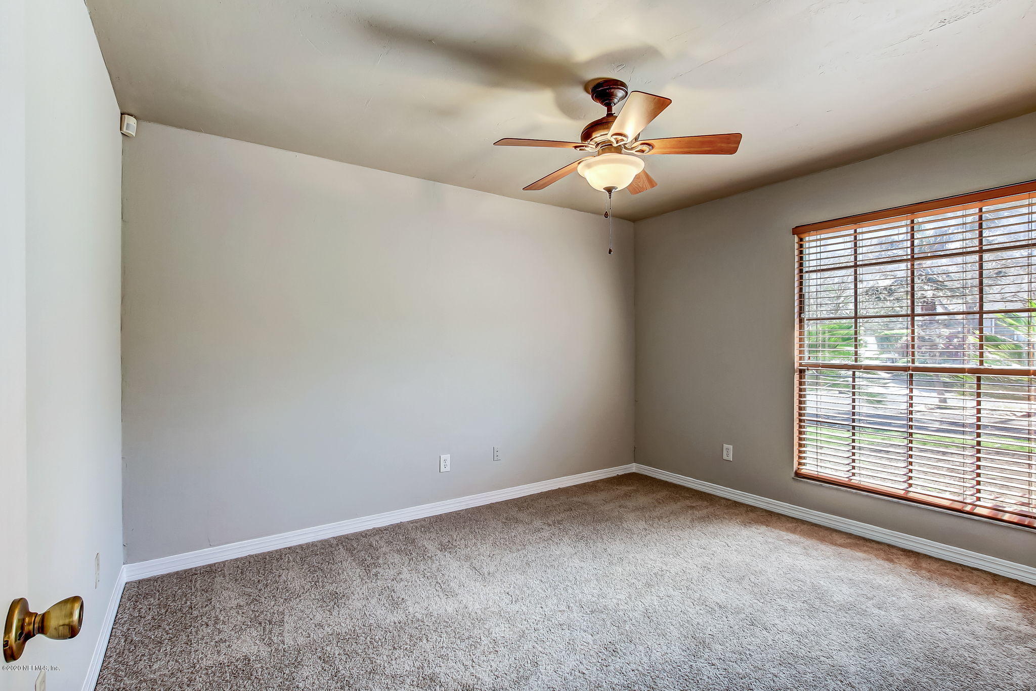 350 Foxridge Road Orange Park, FL 32065 - Photo 17 of 54 an empty room with windows and fan