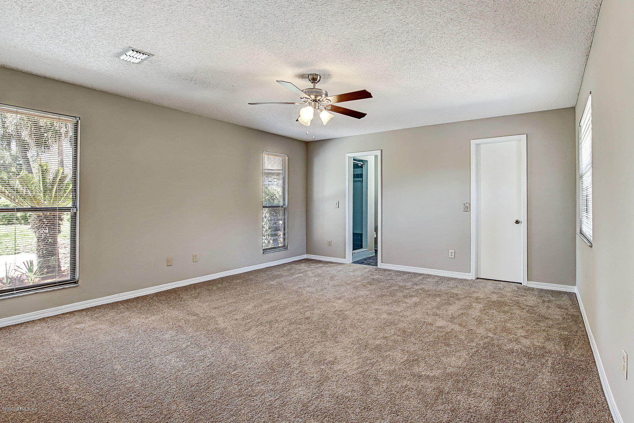 350 Foxridge Road Orange Park, FL 32065 - Photo 28 of 54 an empty room with windows and fan