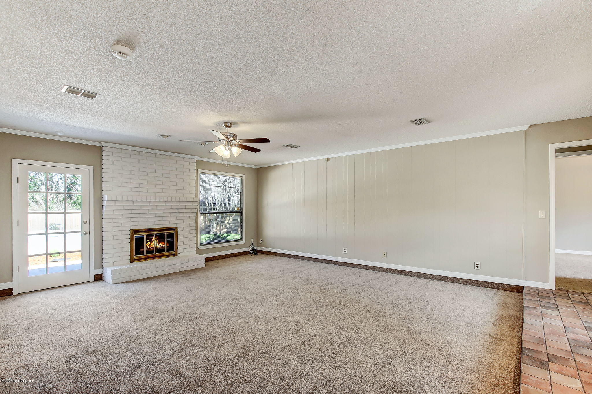 350 Foxridge Road Orange Park, FL 32065 - Photo 33 of 54 an empty room with windows and fireplace