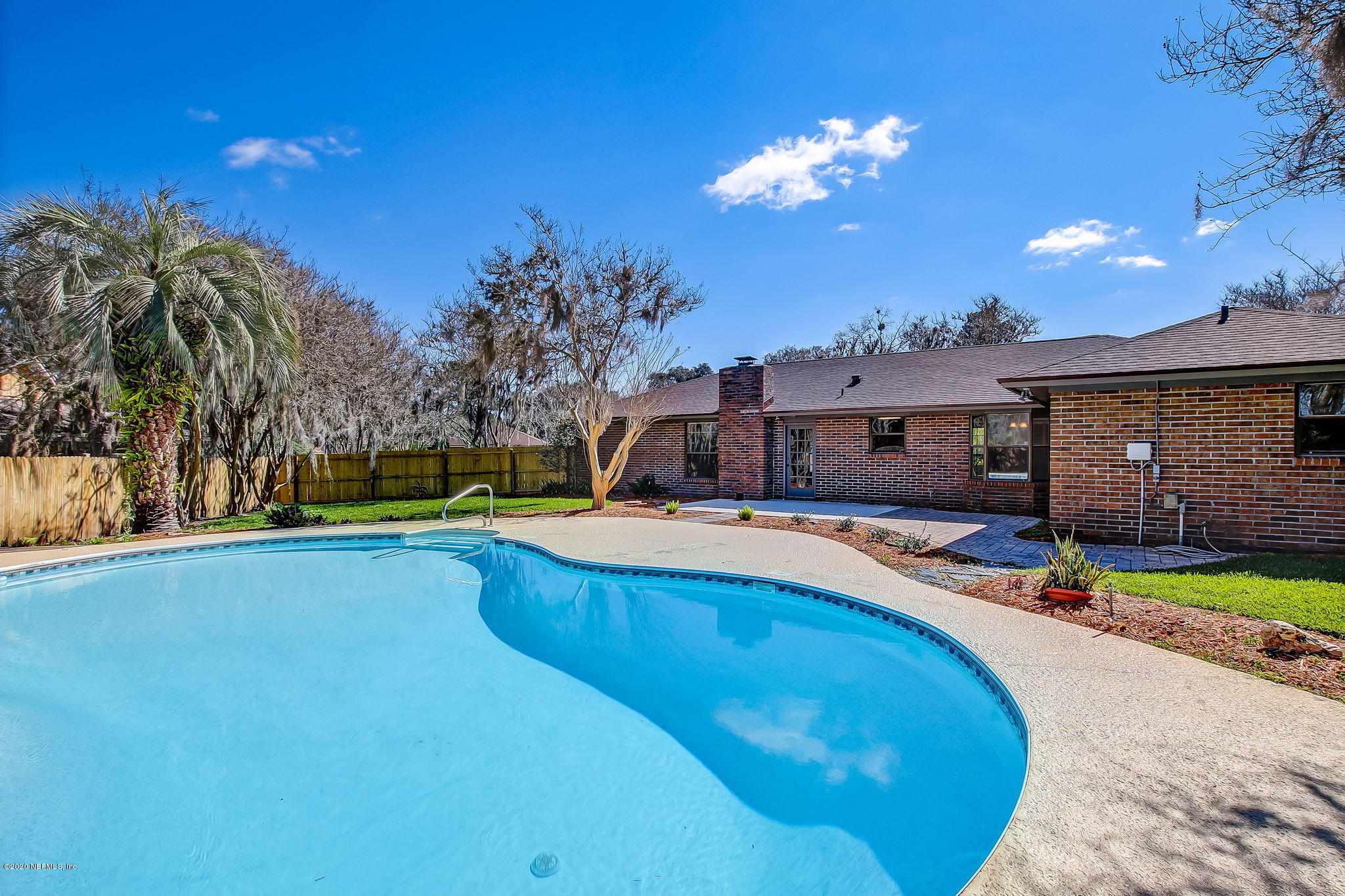 350 Foxridge Road Orange Park, FL 32065 - Photo 41 of 54 a swimming pool with outdoor seating yard and palm tree