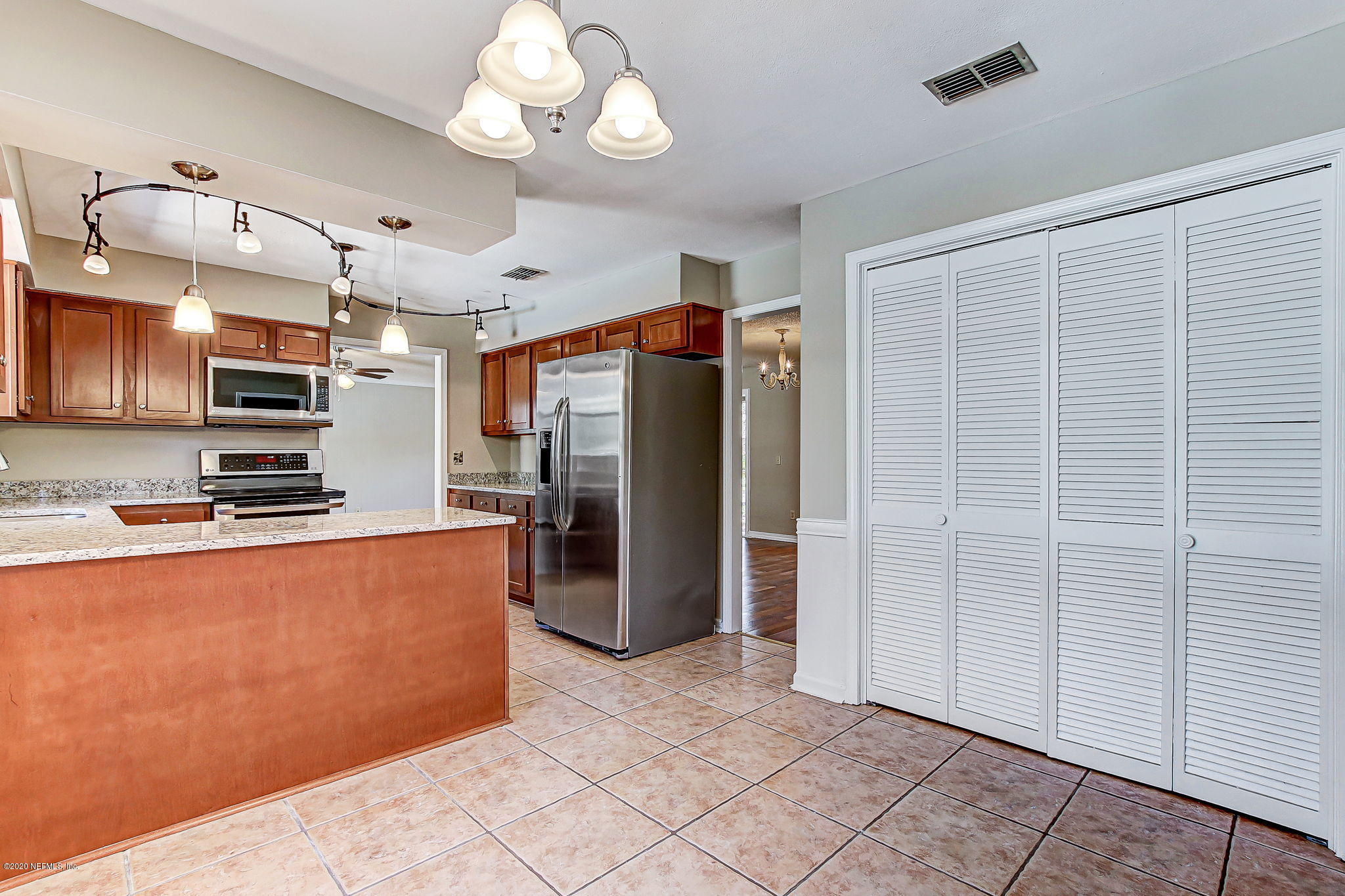 350 Foxridge Road Orange Park, FL 32065 - Photo 7 of 54 a kitchen with stainless steel appliances granite countertop a refrigerator a stove and a sink