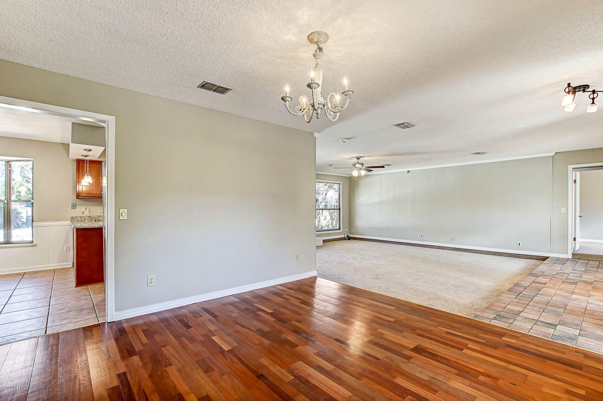 350 Foxridge Road Orange Park, FL 32065 - Photo 10 of 54 a view of a room with wooden floor and chandelier