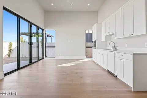 a kitchen with white cabinets