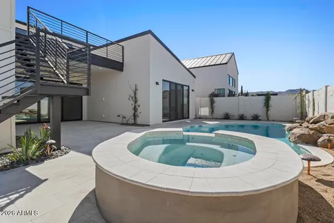 a bathroom with double sink and a mirror