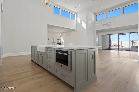 a kitchen with stainless steel appliances a white stove top oven and sink