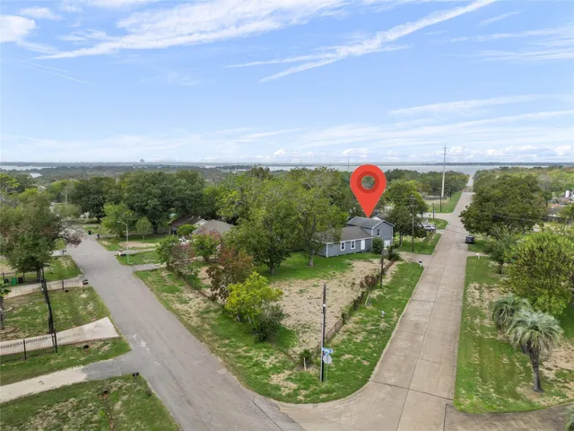 a view of a swimming pool with a yard