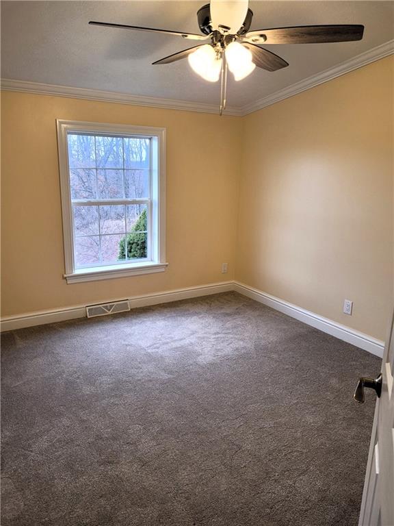 839 Hummingbird Lane Apollo, PA 15613 - Photo 14 of 26 an empty room with windows and fan