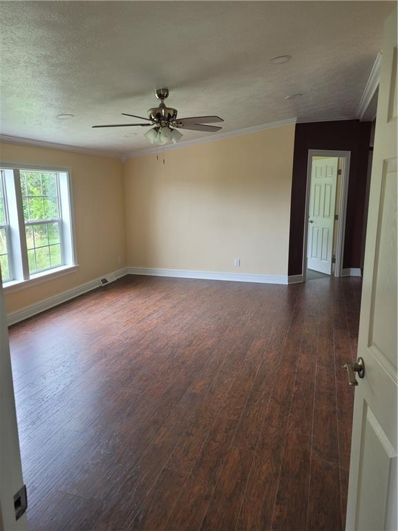 839 Hummingbird Lane Apollo, PA 15613 - Photo 10 of 26 an empty room with wooden floor fan and windows