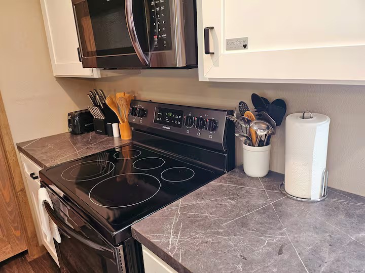 105 Saddle Surrey Road Coldspring, TX 77331 - Photo 20 of 48 a kitchen with a stove and a sink