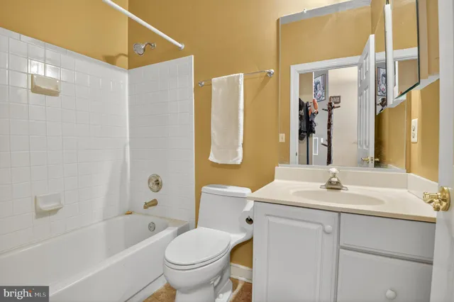 a bedroom with a bed chair and a window