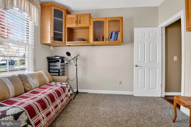 a bed room with a bed and a window