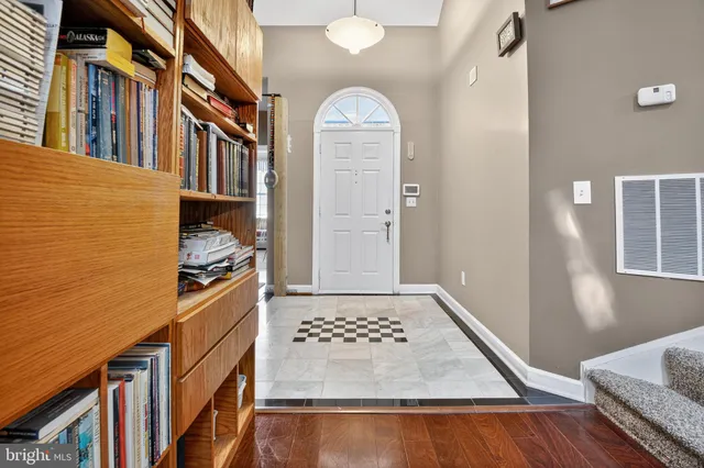 a view of an entryway with kitchen