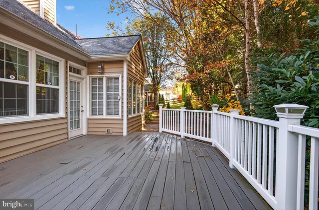 a view of a house with wooden deck
