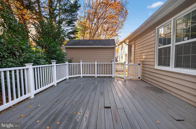 a view of a house with wooden deck