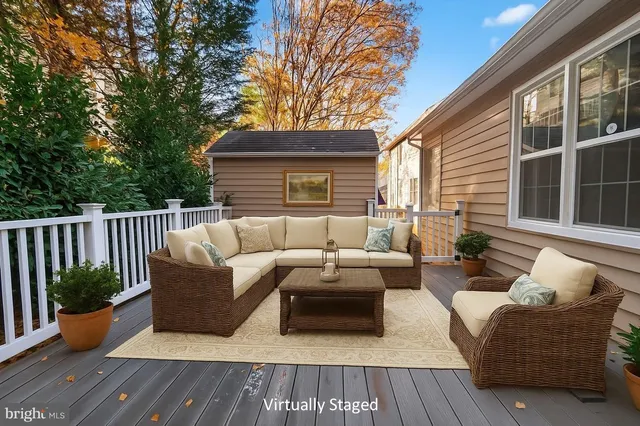 a balcony with furniture and wooden floor