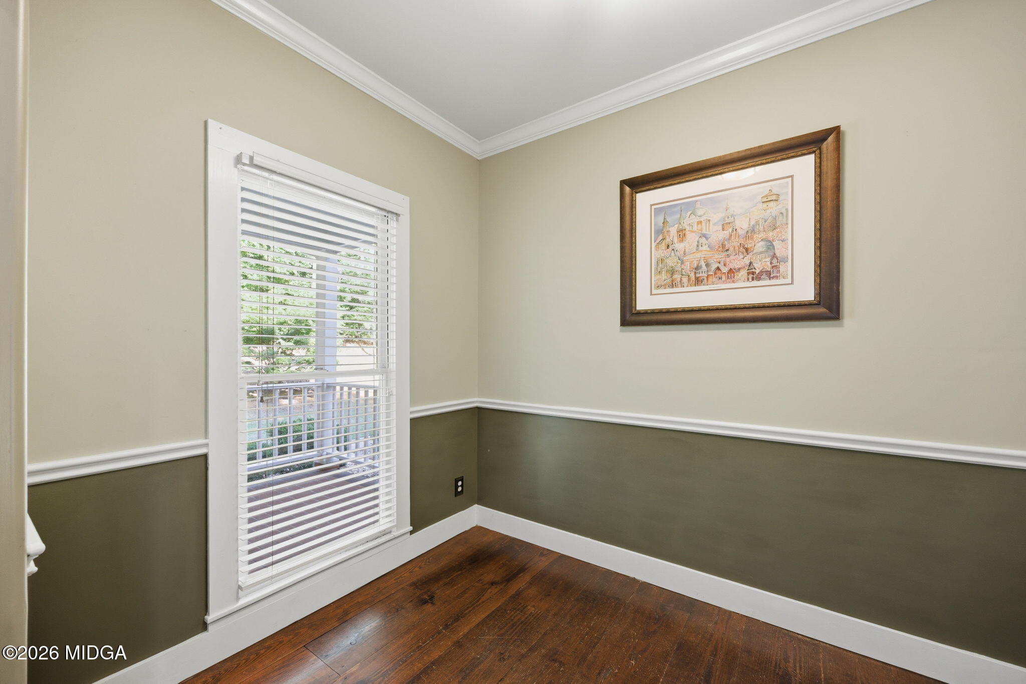 4686 Johnstonville Road Forsyth, GA 31029 - Photo 19 of 34 a view of an empty room with wooden floor and a window