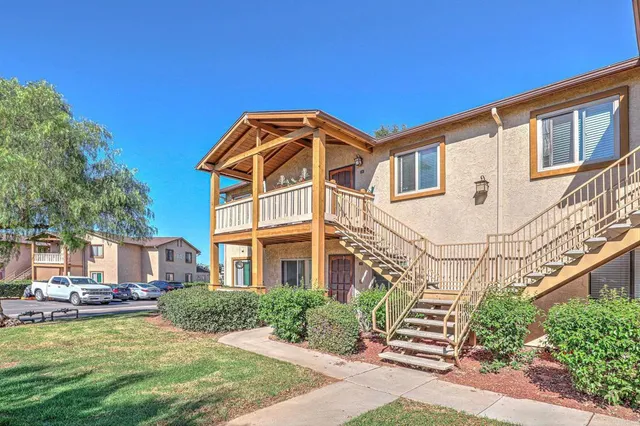 a view of a building with a yard