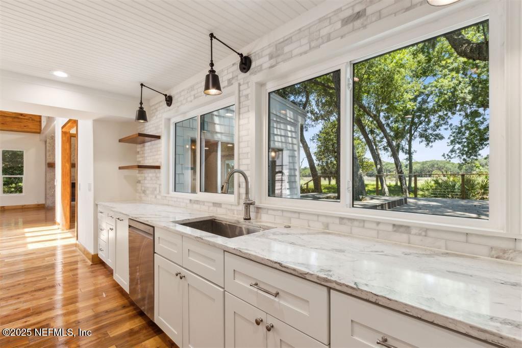 22 Belted Kingfisher Road Fernandina Beach, FL 32034 - Photo 17 of 70 a view of a kitchen with a sink and large window