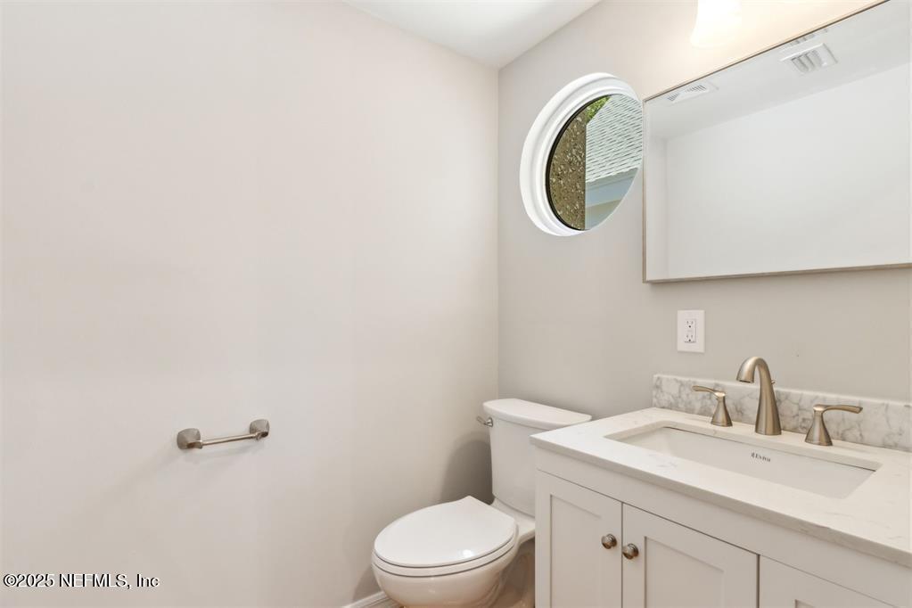 22 Belted Kingfisher Road Fernandina Beach, FL 32034 - Photo 22 of 70 a bathroom with a toilet and a sink