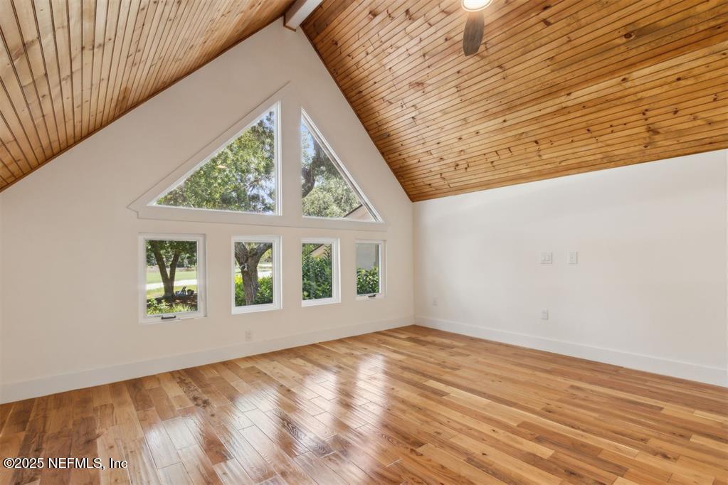 22 Belted Kingfisher Road Fernandina Beach, FL 32034 - Photo 27 of 70 a view of an empty room with wooden floor and a window