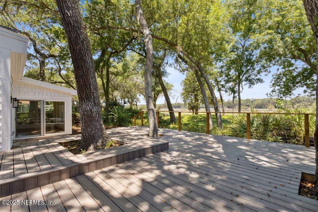 22 Belted Kingfisher Road Fernandina Beach, FL 32034 - Photo 3 of 70 a view of a yard with plants and trees