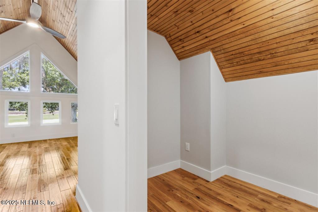 22 Belted Kingfisher Road Fernandina Beach, FL 32034 - Photo 33 of 70 a view of room with window and wooden floor
