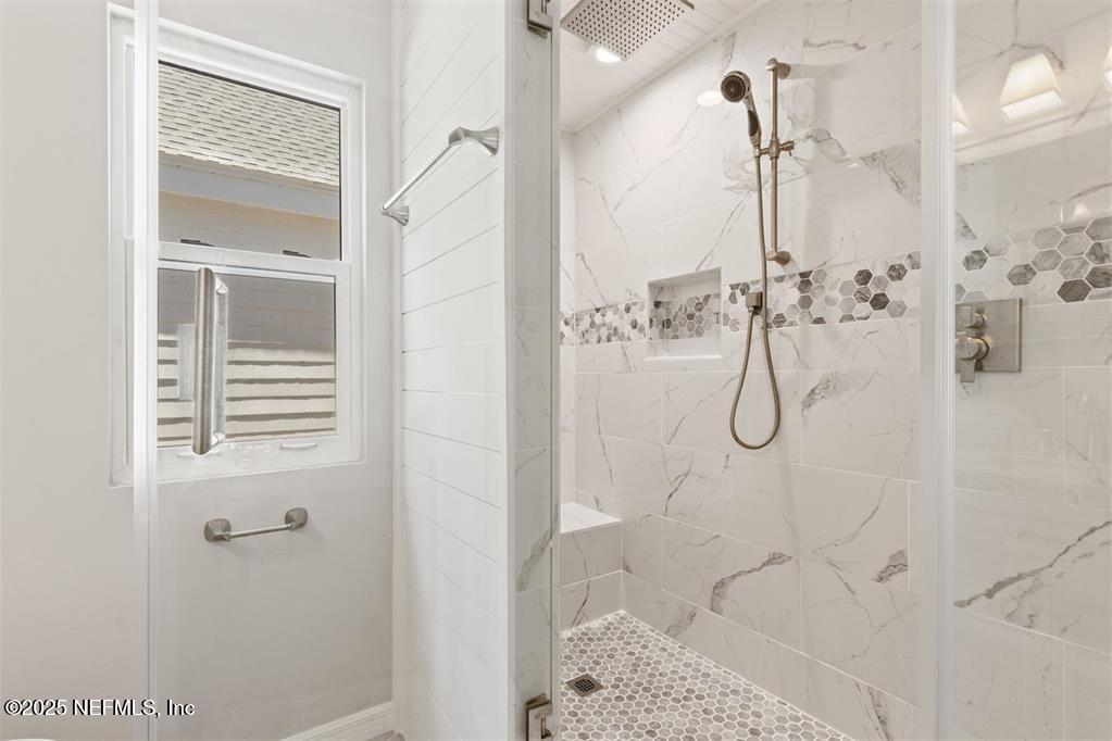 22 Belted Kingfisher Road Fernandina Beach, FL 32034 - Photo 38 of 70 a bathroom with a glass shower door
