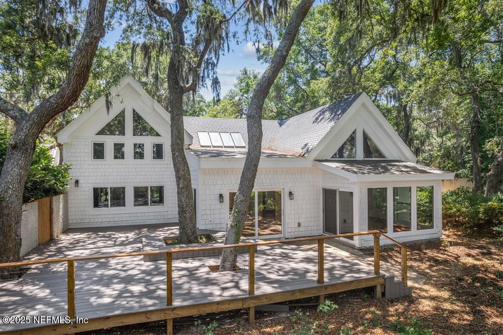 22 Belted Kingfisher Road Fernandina Beach, FL 32034 - Photo 46 of 70 front view of a house with yard and trees