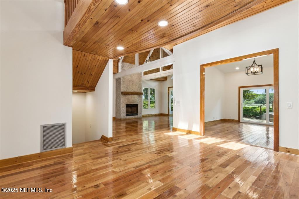 22 Belted Kingfisher Road Fernandina Beach, FL 32034 - Photo 7 of 70 a view of a hallway with wooden floor and a living room