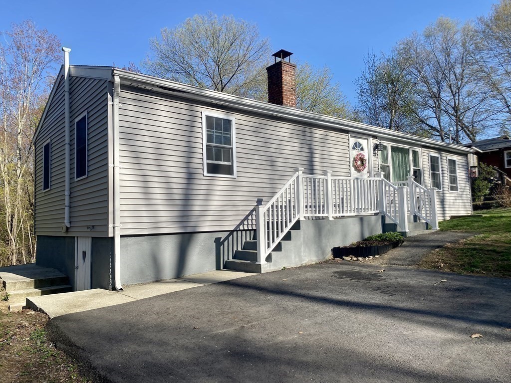 3 Leland Hill Road Sutton, MA 01590 - Photo 29 of 38 a front view of a house with a yard