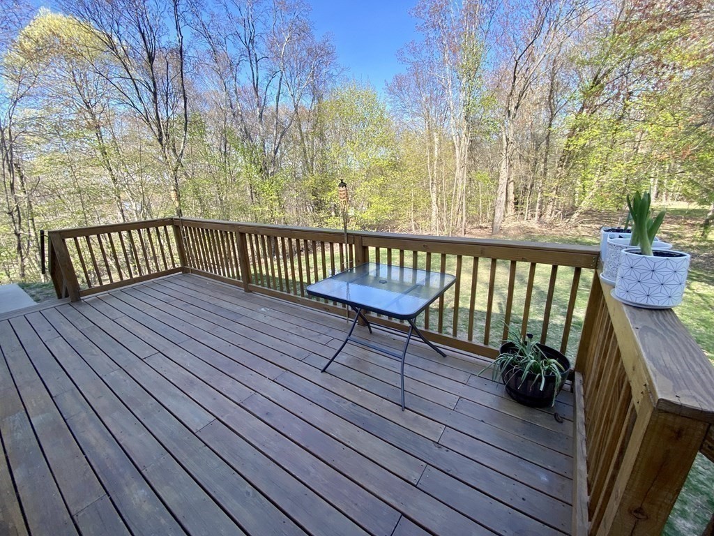 3 Leland Hill Road Sutton, MA 01590 - Photo 31 of 38 a view of a wooden deck with a bench
