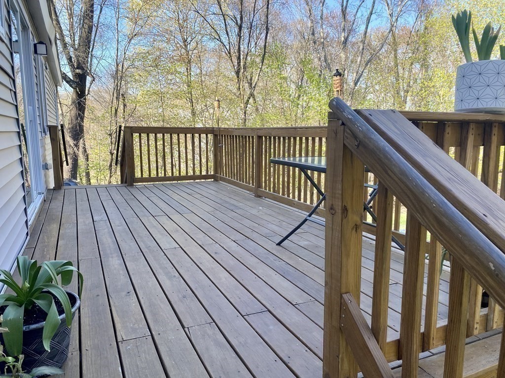 3 Leland Hill Road Sutton, MA 01590 - Photo 32 of 38 a view of deck with wooden floor and fence with a garden
