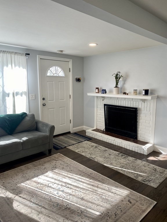 3 Leland Hill Road Sutton, MA 01590 - Photo 4 of 38 a living room with furniture and a fireplace