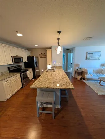 a view of a living room and dining room