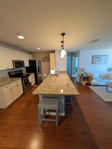 a view of a living room and dining room