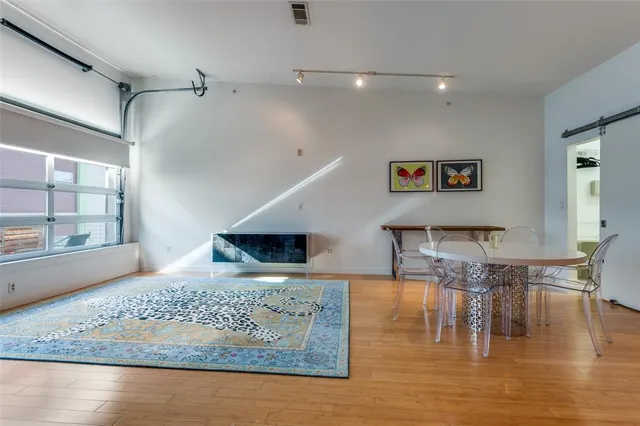 a kitchen with a counter top space and wooden floor