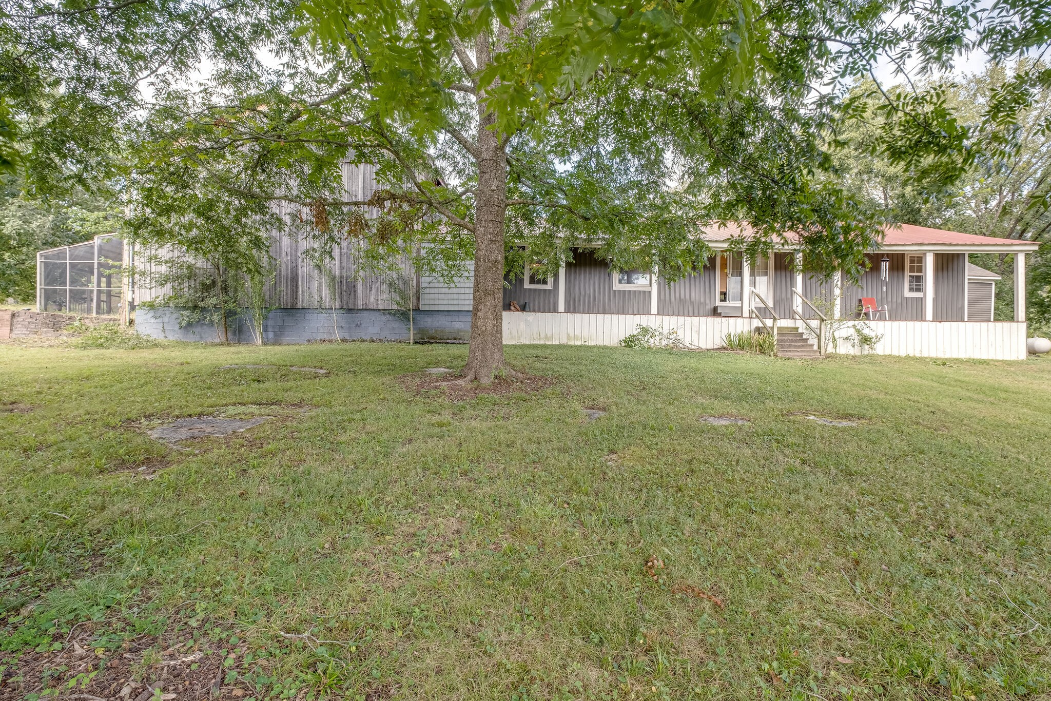 1889 Ford Road Lebanon, TN 37087 - Photo 15 of 18 a view of a trees in a yard with a house