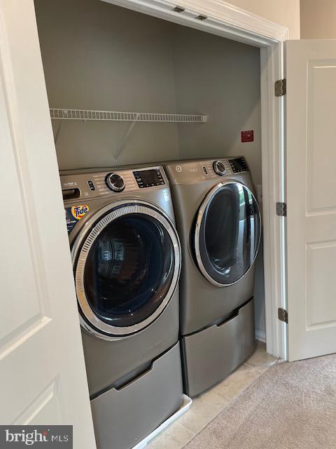 8235 Front Loop Rockville, MD 20855 - Photo 11 of 22 a utility room with dryer and washer