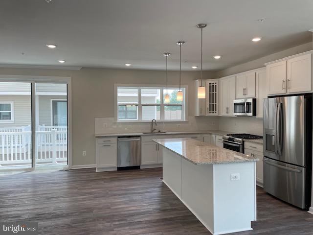 8235 Front Loop Rockville, MD 20855 - Photo 22 of 22 a kitchen with stainless steel appliances granite countertop a refrigerator a sink dishwasher a stove and white cabinets with wooden floor