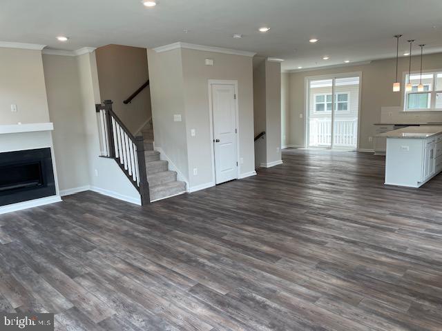8235 Front Loop Rockville, MD 20855 - Photo 6 of 22 a view of a hallway with wooden floor and staircase