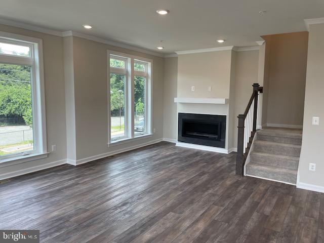 8235 Front Loop Rockville, MD 20855 - Photo 9 of 22 a view of an empty room with wooden floor fireplace and a window