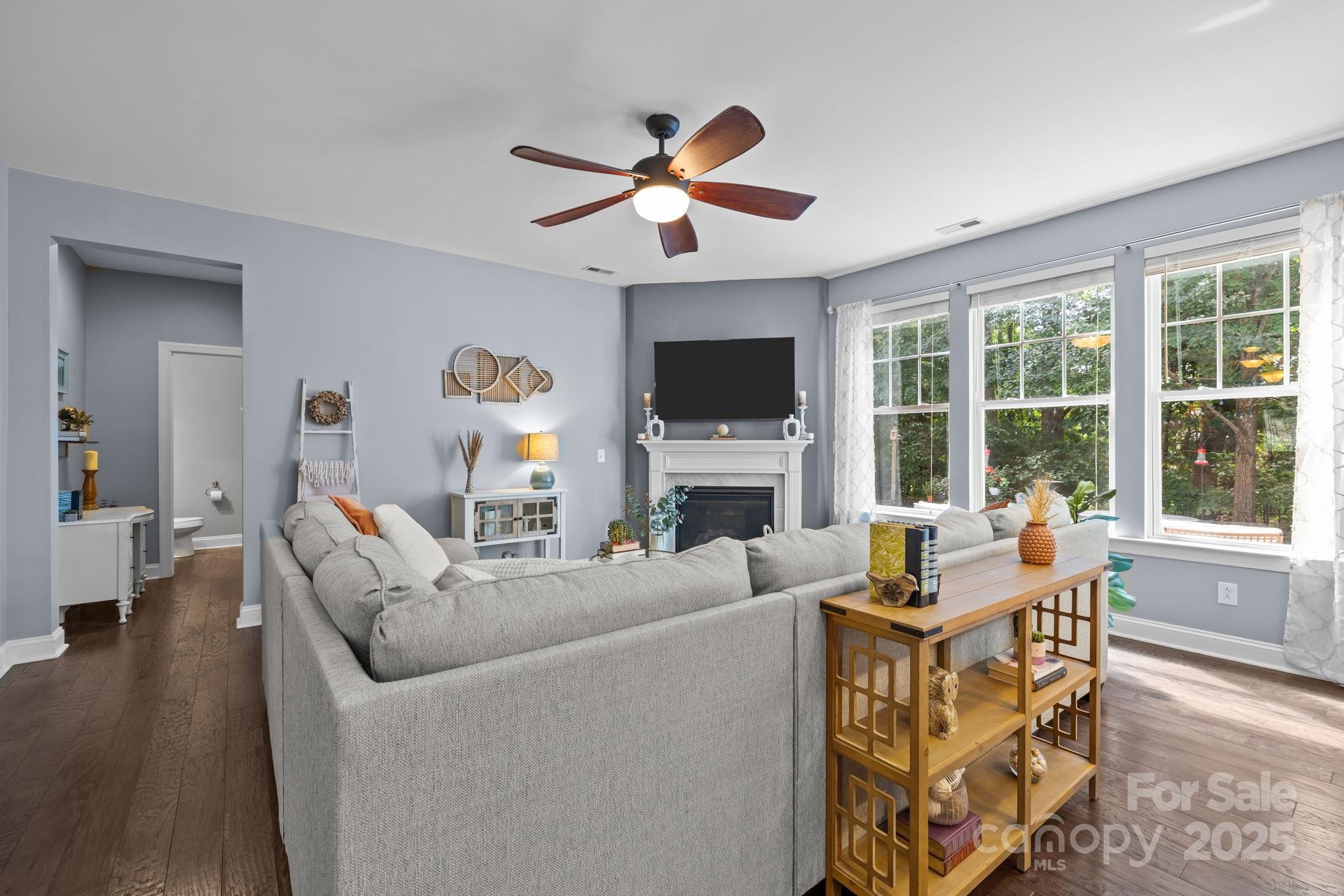 324 Windell Drive Fort Mill, SC 29708 - Photo 15 of 47 a living room with furniture a fireplace and a flat screen tv