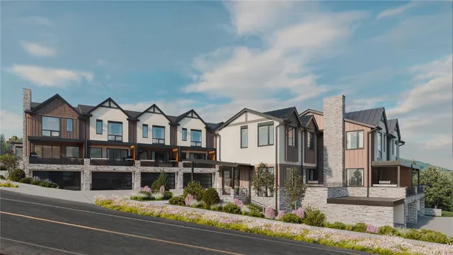 a view of a big house with wooden stairs and stairs
