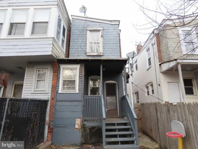 a view of a house with iron stairs