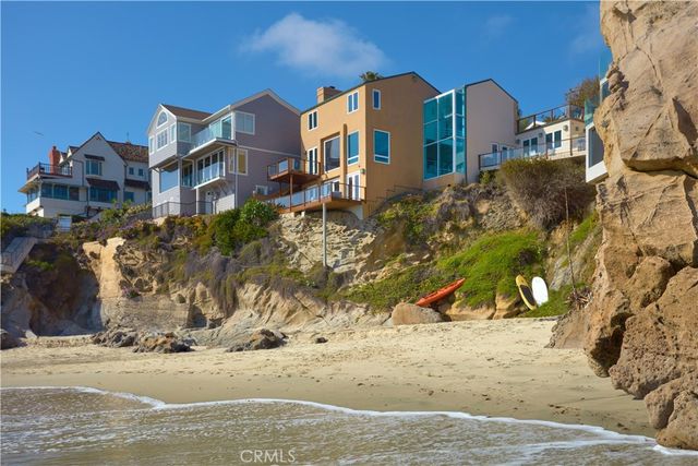 a view of a street with house in the background