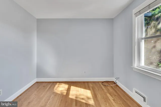 a view of an empty room and window